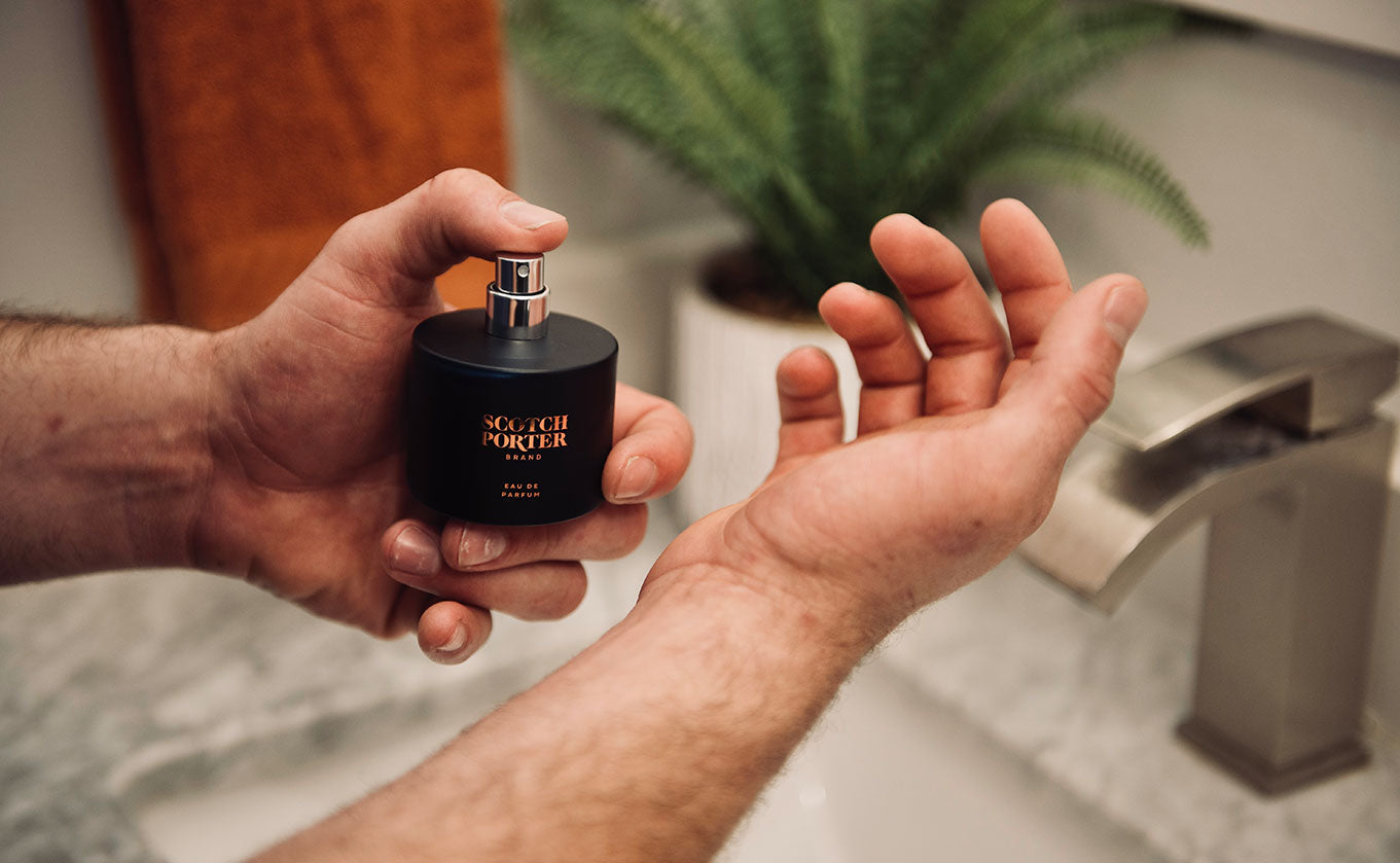 Man hands showing a perfume from Scotch Porter